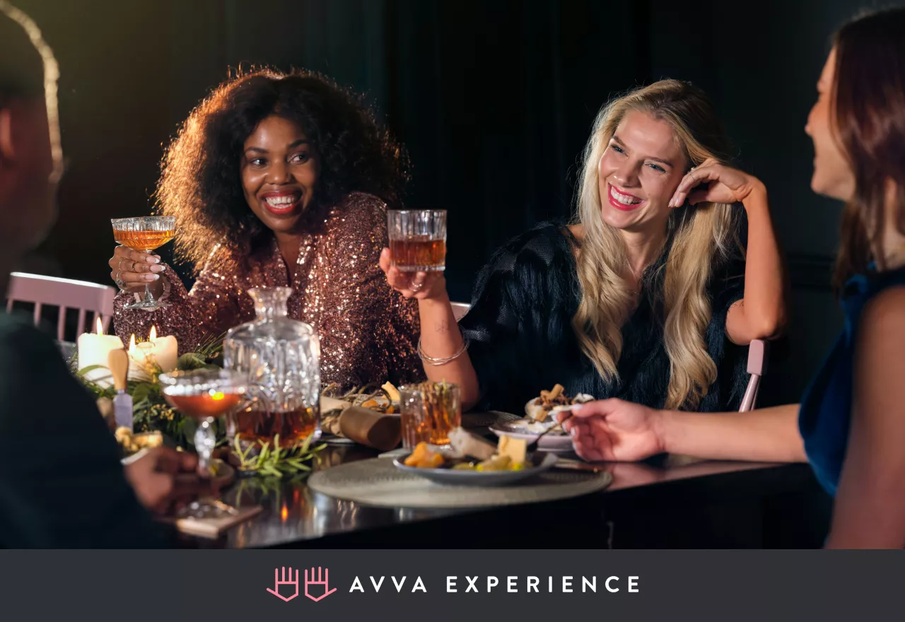 Women chatting at a table during the holiday season