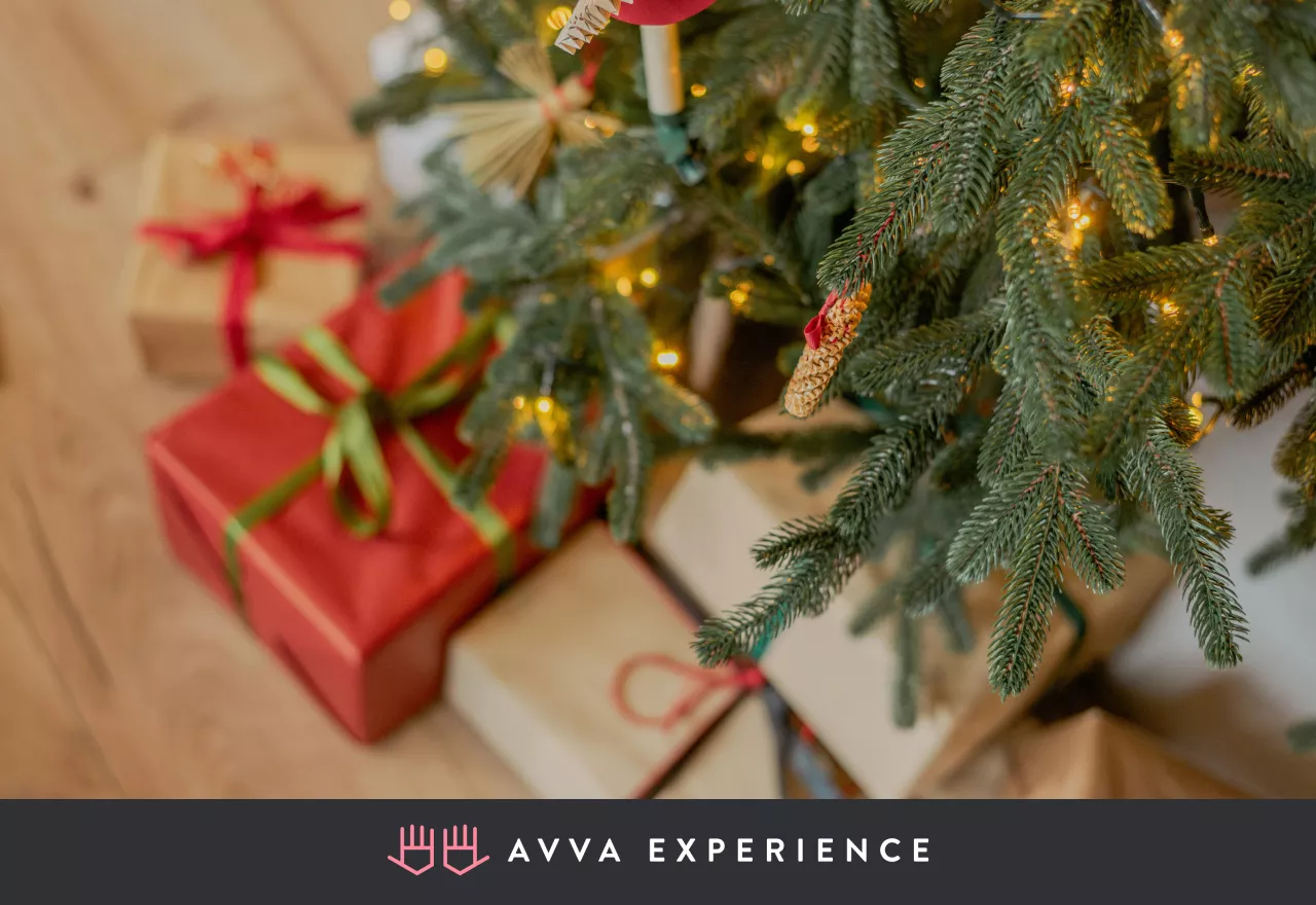 festive living room with christmas tree and holiday gifts