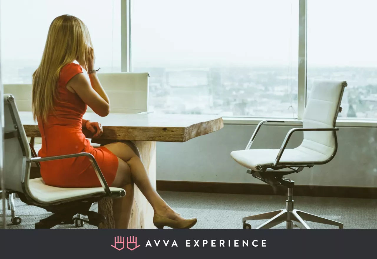 Office worker having a phone conversation at her desk