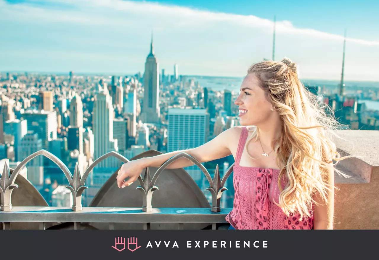 Woman enjoying the view, smiling with joy over the cityscape