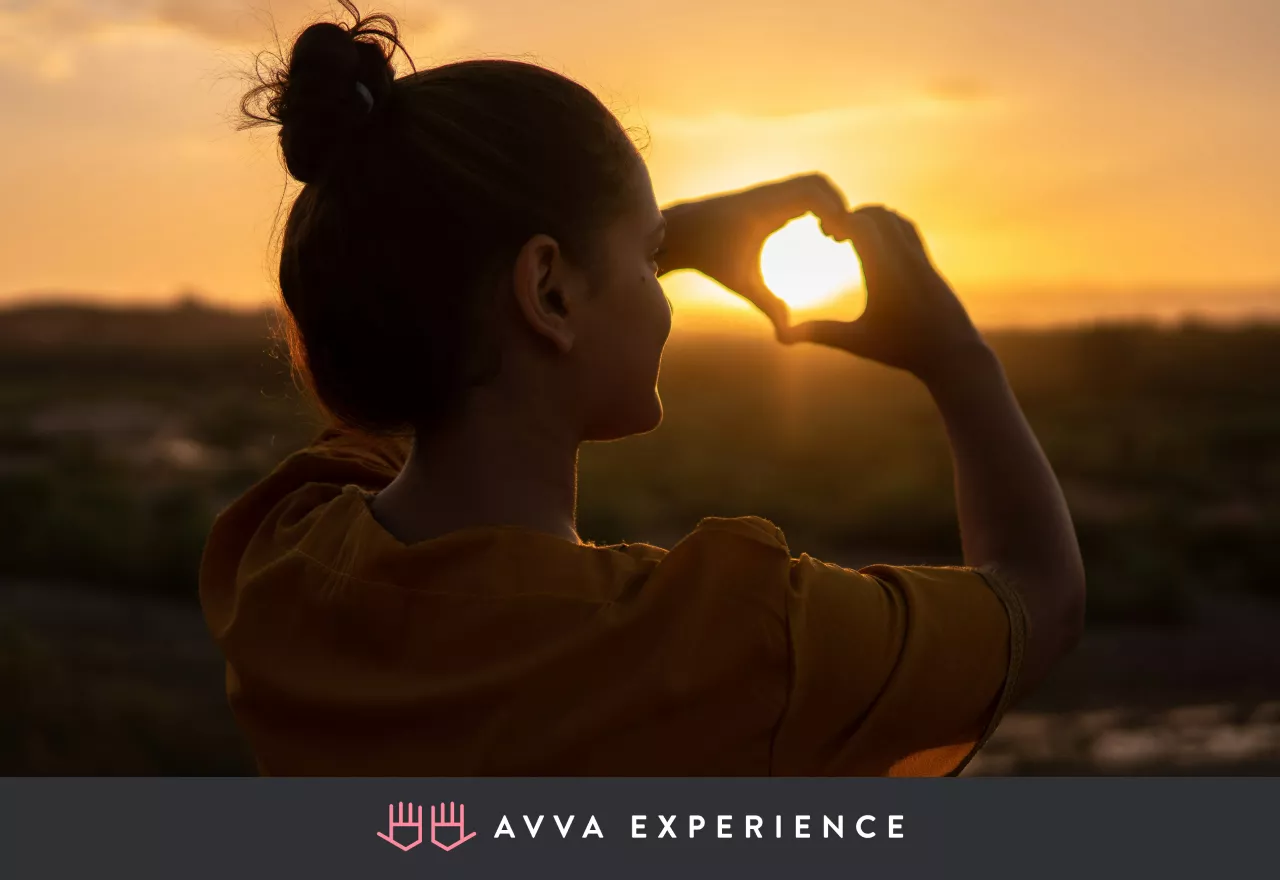Silhouette of woman at sunset