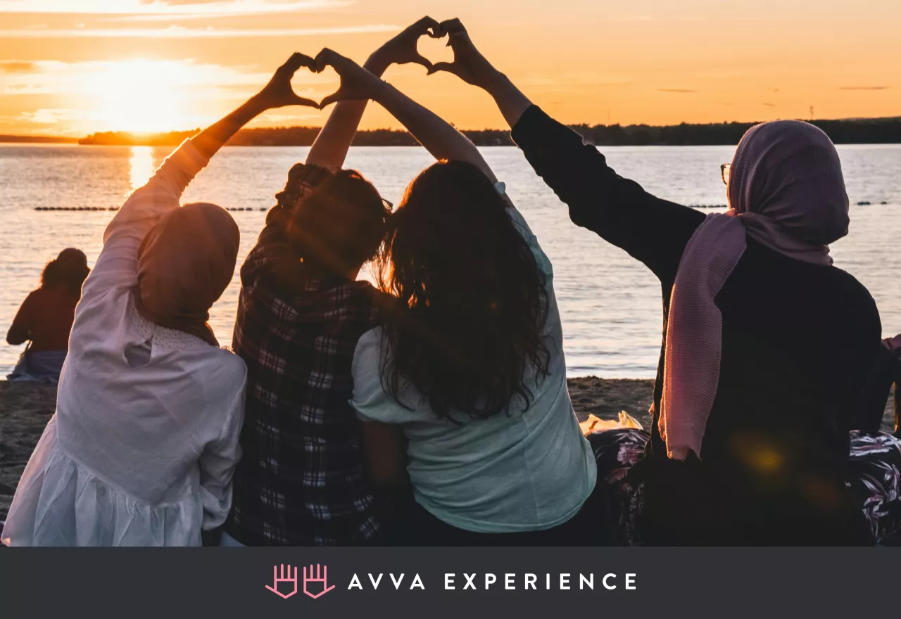 Happy team enjoying a sunset